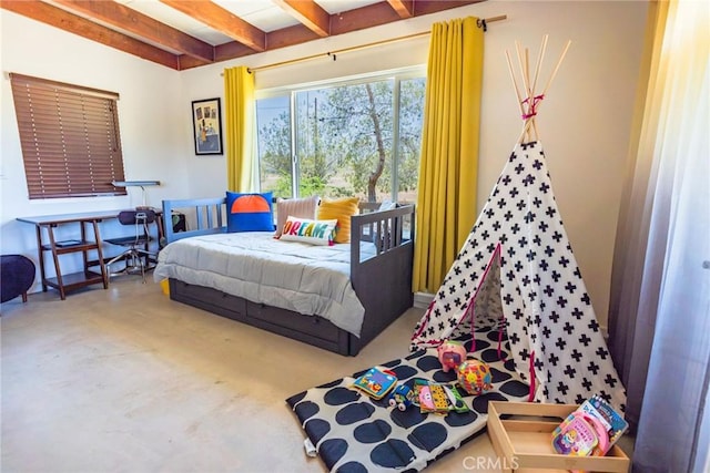 bedroom featuring finished concrete flooring and beam ceiling