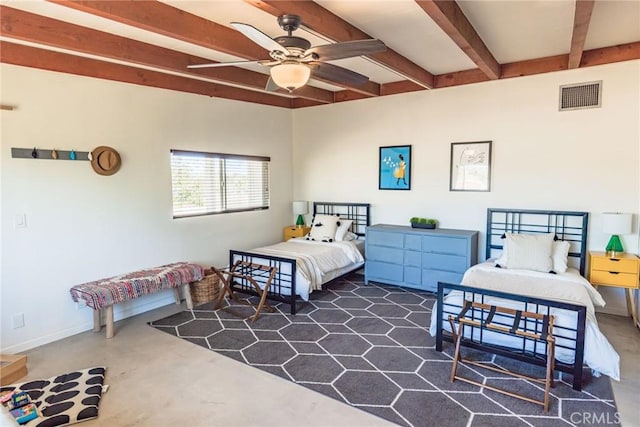 bedroom with finished concrete floors, beamed ceiling, baseboards, and visible vents