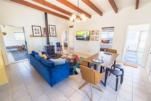 3667 Lucerne Vista Ave, Yucca Valley, CA 92284 - living room featuring a wood stove, light tile patterned floors, and a chandelier