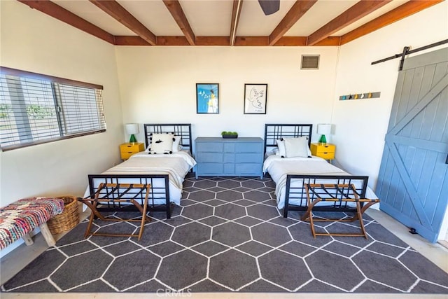 carpeted bedroom featuring visible vents, a barn door, and beamed ceiling