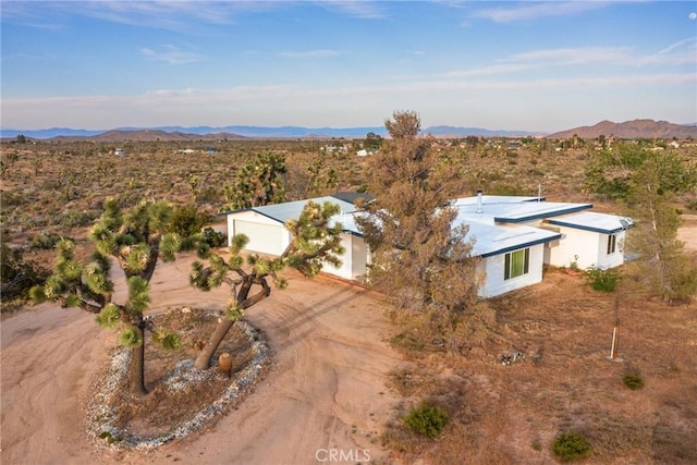 bird's eye view featuring a mountain view and view of desert