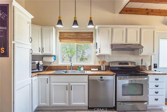 3667 Lucerne Vista Ave, Yucca Valley, CA 92284 - kitchen featuring appliances with stainless steel finishes, under cabinet range hood, backsplash, white cabinetry, and beam ceiling