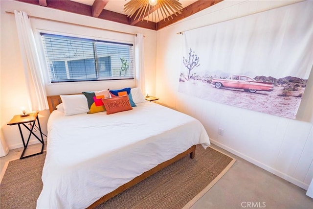 3667 Lucerne Vista Ave, Yucca Valley, CA 92284 - bedroom with beamed ceiling, carpet, and baseboards