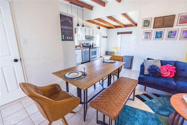 dining space featuring beam ceiling, baseboards, and light tile patterned floors