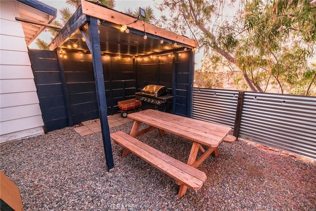 exterior space with grilling area and fence