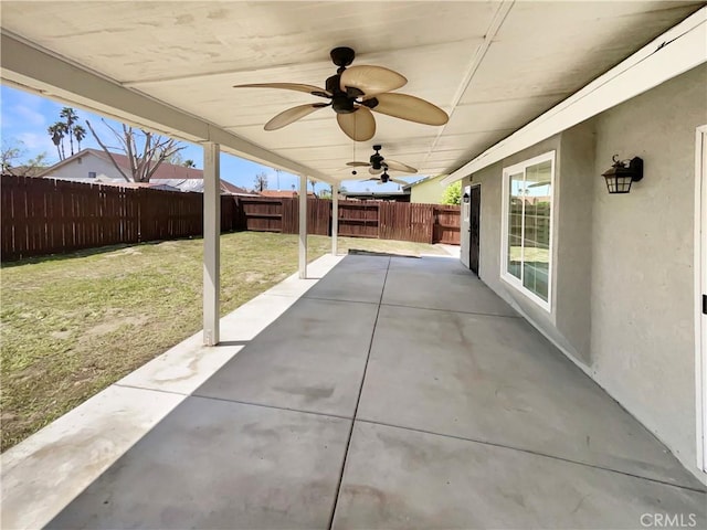 view of patio featuring a fenced backyard and a ceiling fan