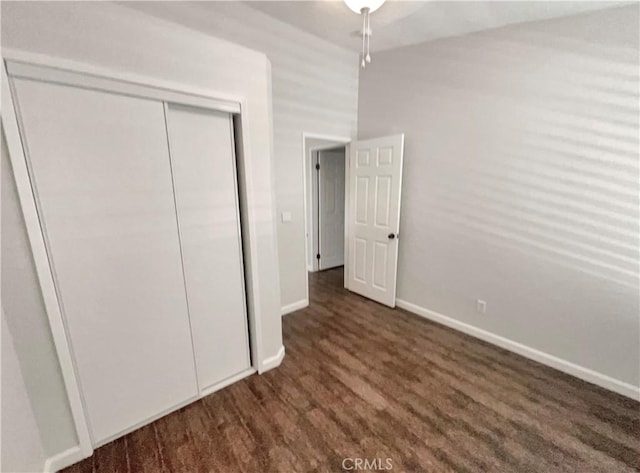 unfurnished bedroom featuring a closet and baseboards