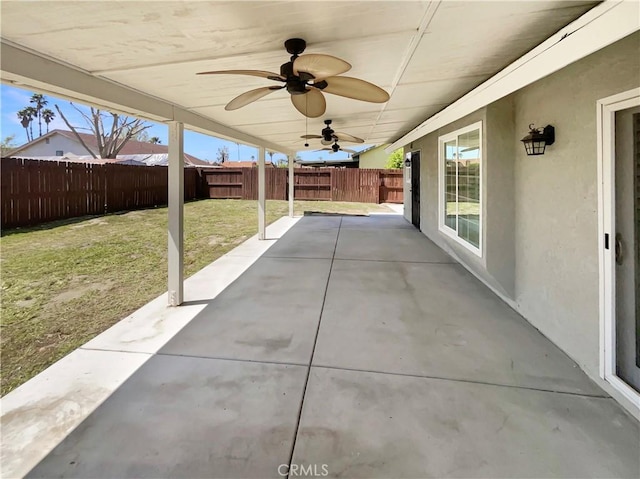 view of patio with a fenced backyard and a ceiling fan