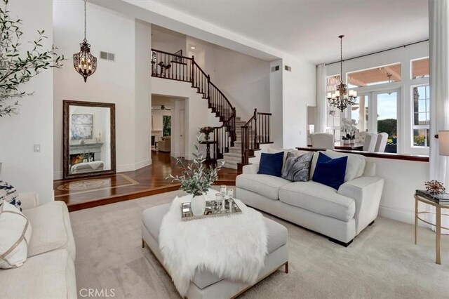 14043 Shepherd Dr, Rancho Cucamonga, CA 91739 - living area featuring a chandelier, stairway, and a high ceiling