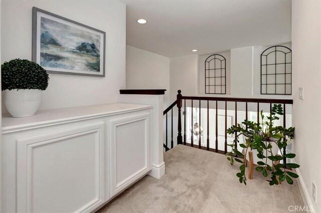 14043 Shepherd Dr, Rancho Cucamonga, CA 91739 - corridor featuring light carpet, baseboards, recessed lighting, and an upstairs landing
