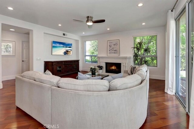 14043 Shepherd Dr, Rancho Cucamonga, CA 91739 - living room featuring ceiling fan, wood finished floors, baseboards, a fireplace, and recessed lighting