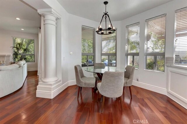 14043 Shepherd Dr, Rancho Cucamonga, CA 91739 - dining room featuring ornate columns, plenty of natural light, a chandelier, dark wood-style floors, and recessed lighting
