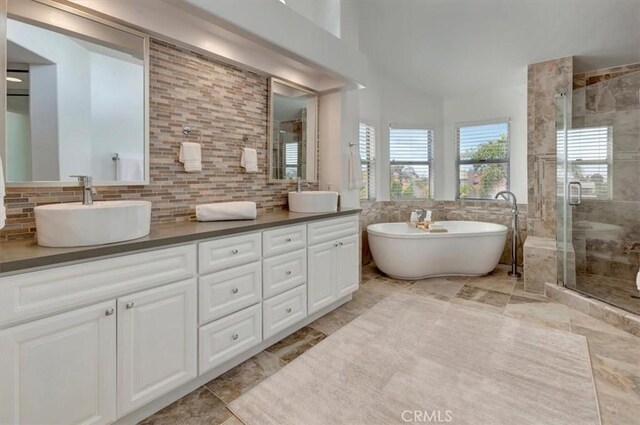 14043 Shepherd Dr, Rancho Cucamonga, CA 91739 - bathroom with a stall shower, double vanity, a freestanding bath, and backsplash