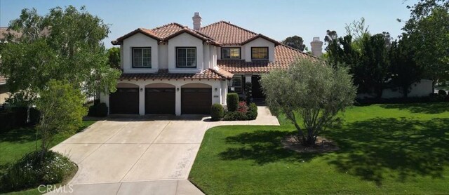 14043 Shepherd Dr, Rancho Cucamonga, CA 91739 - mediterranean / spanish-style house featuring a tiled roof, a chimney, driveway, an attached garage, and stucco siding