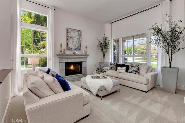 14043 Shepherd Dr, Rancho Cucamonga, CA 91739 - carpeted living area with plenty of natural light, a glass covered fireplace, and baseboards