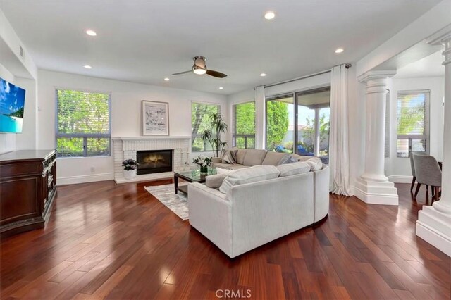 14043 Shepherd Dr, Rancho Cucamonga, CA 91739 - living room with ornate columns, a ceiling fan, a fireplace, dark wood finished floors, and recessed lighting