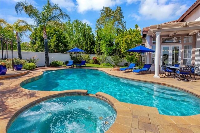 14043 Shepherd Dr, Rancho Cucamonga, CA 91739 - view of pool featuring a patio area, a fenced backyard, a pool with connected hot tub, and ceiling fan