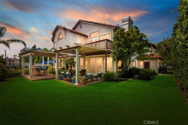 14043 Shepherd Dr, Rancho Cucamonga, CA 91739 - back of house featuring a balcony, a pergola, a chimney, a yard, and a patio area