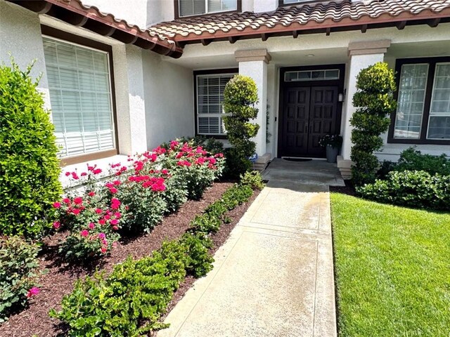14043 Shepherd Dr, Rancho Cucamonga, CA 91739 - doorway to property with stucco siding and a tiled roof