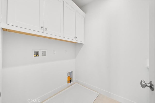 312 Carefree, Irvine, CA 92618 - laundry room with cabinet space, baseboards, and washer hookup