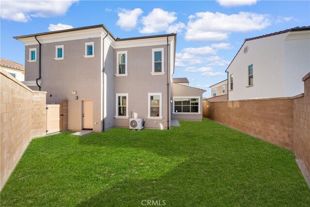 312 Carefree, Irvine, CA 92618 - back of house with a yard, stucco siding, and a fenced backyard