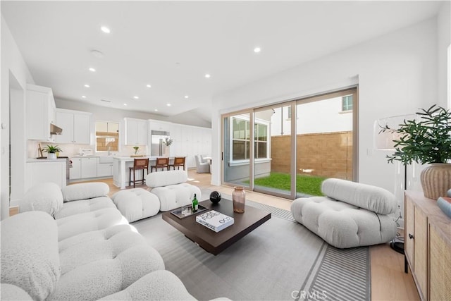 312 Carefree, Irvine, CA 92618 - living area with recessed lighting and light wood-style flooring