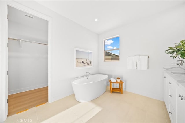 312 Carefree, Irvine, CA 92618 - full bath with a freestanding tub, vanity, and baseboards