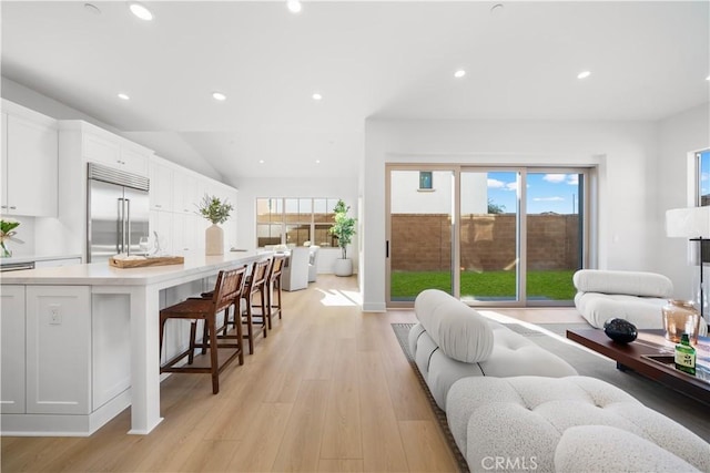 312 Carefree, Irvine, CA 92618 - living room with light wood-type flooring, recessed lighting, and lofted ceiling