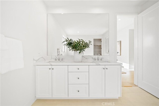 312 Carefree, Irvine, CA 92618 - bathroom featuring a sink, tile patterned floors, double vanity, and baseboards