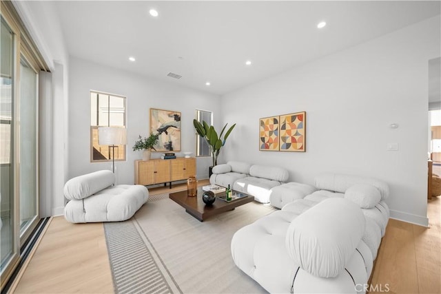 312 Carefree, Irvine, CA 92618 - living area featuring recessed lighting, light wood-style floors, baseboards, and visible vents