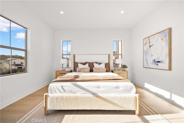 312 Carefree, Irvine, CA 92618 - bedroom featuring recessed lighting, baseboards, and wood finished floors