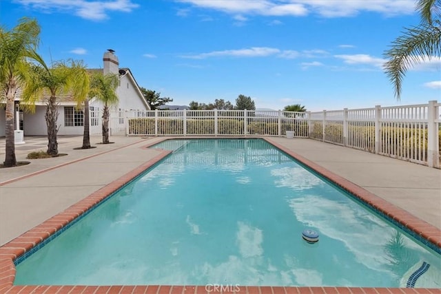view of pool featuring a patio area, fence, and a fenced in pool