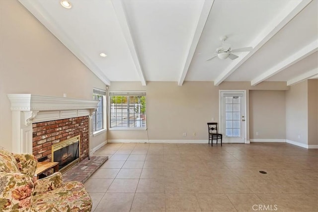 unfurnished living room with baseboards, a fireplace, light tile patterned floors, beam ceiling, and ceiling fan