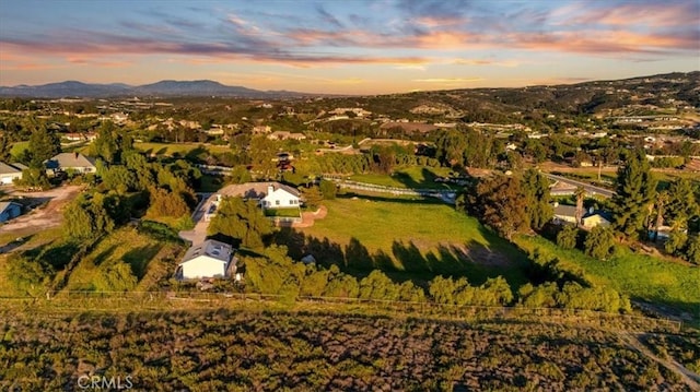 drone / aerial view featuring a mountain view