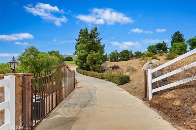 view of community featuring fence and a gate