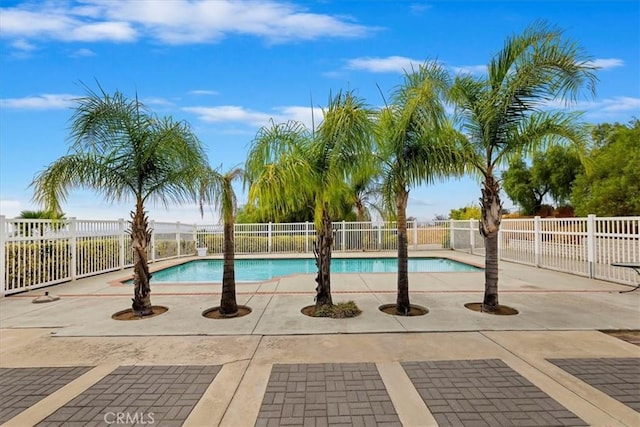 view of pool with a patio area, fence, and a fenced in pool