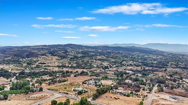 birds eye view of property featuring a mountain view