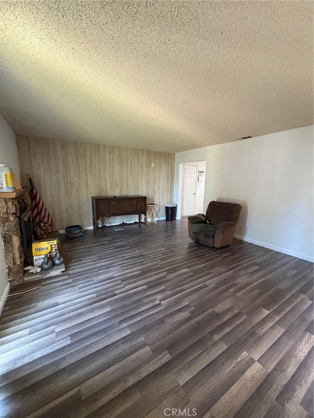 3670 Upper Terrace Dr, Riverside, CA 92505 - living area featuring dark wood-style flooring, a textured ceiling, and baseboards