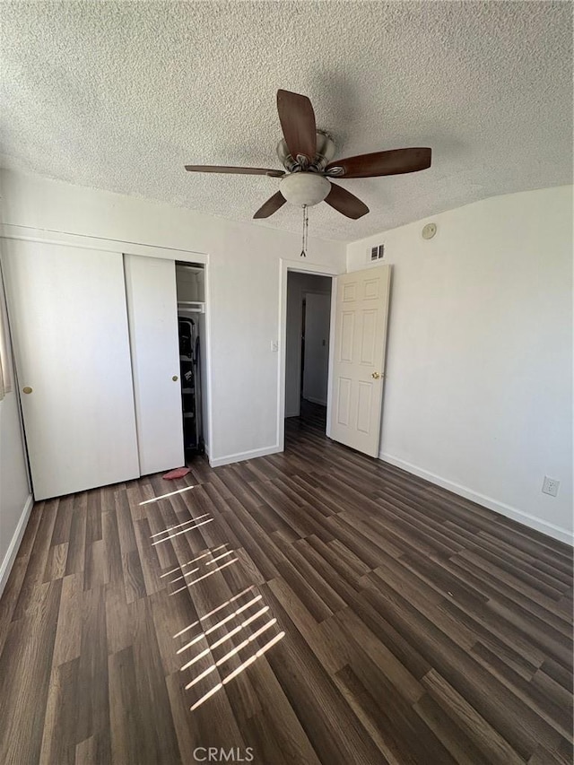 3670 Upper Terrace Dr, Riverside, CA 92505 - unfurnished bedroom with a textured ceiling, wood finished floors, a closet, baseboards, and a ceiling fan