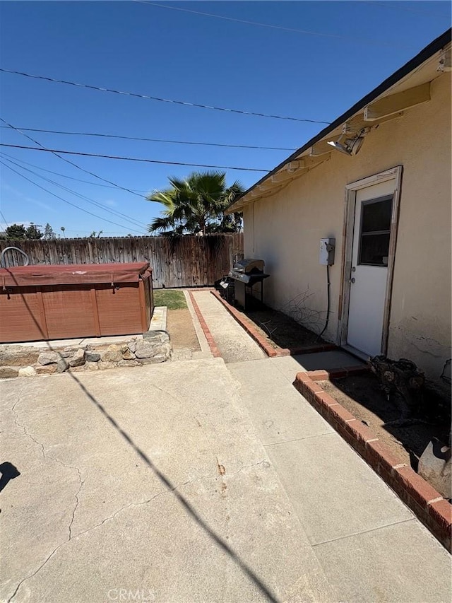 3670 Upper Terrace Dr, Riverside, CA 92505 - view of patio with a hot tub and fence