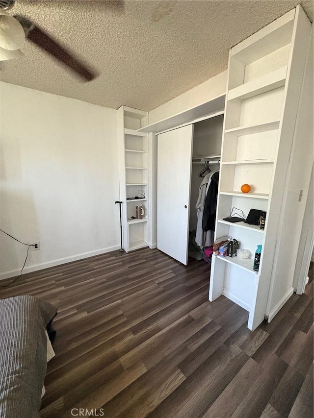 3670 Upper Terrace Dr, Riverside, CA 92505 - unfurnished bedroom featuring dark wood-style flooring, a closet, a textured ceiling, ceiling fan, and baseboards