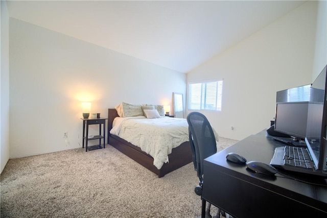 carpeted bedroom featuring lofted ceiling