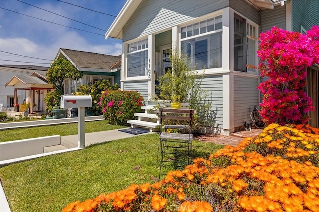 exterior space with a yard