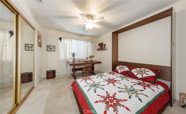 bedroom featuring light tile patterned floors and a ceiling fan