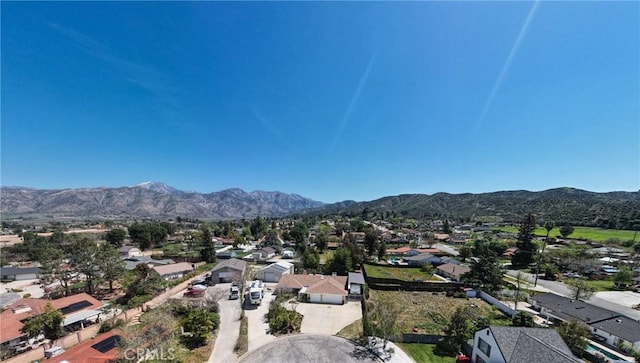 birds eye view of property with a residential view and a mountain view