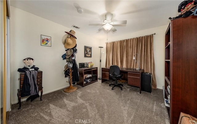 office area with carpet flooring, baseboards, a ceiling fan, and visible vents