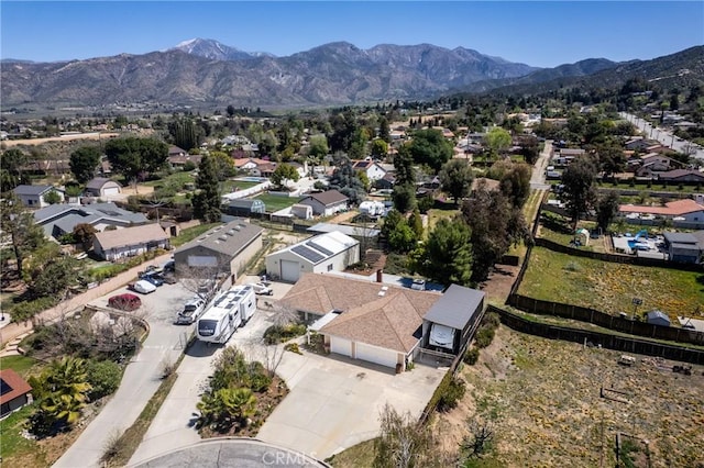 birds eye view of property featuring a mountain view and a residential view
