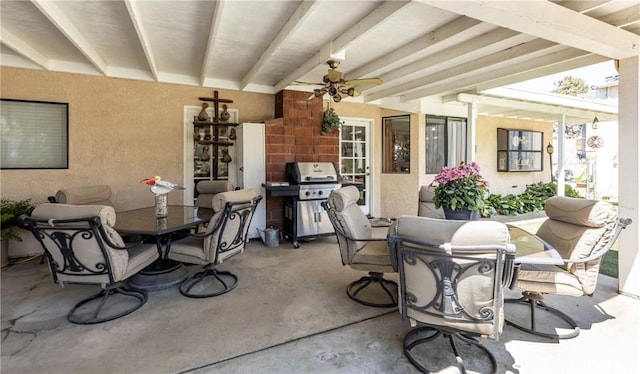 view of patio / terrace featuring area for grilling, outdoor dining space, and ceiling fan