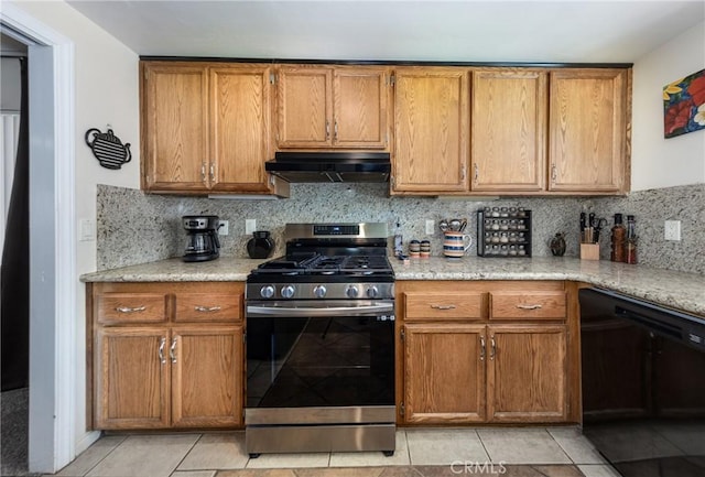 kitchen with exhaust hood, dishwasher, stainless steel range with gas cooktop, brown cabinetry, and light tile patterned flooring