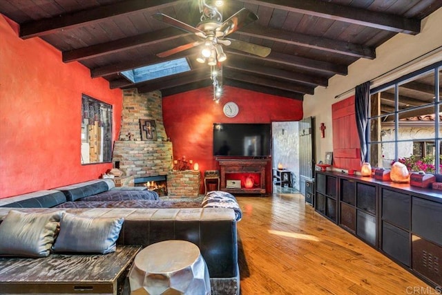4210 Black Mountain Rd, La Mesa, CA 91941 - living room featuring a fireplace, wood finished floors, wooden ceiling, a ceiling fan, and a skylight